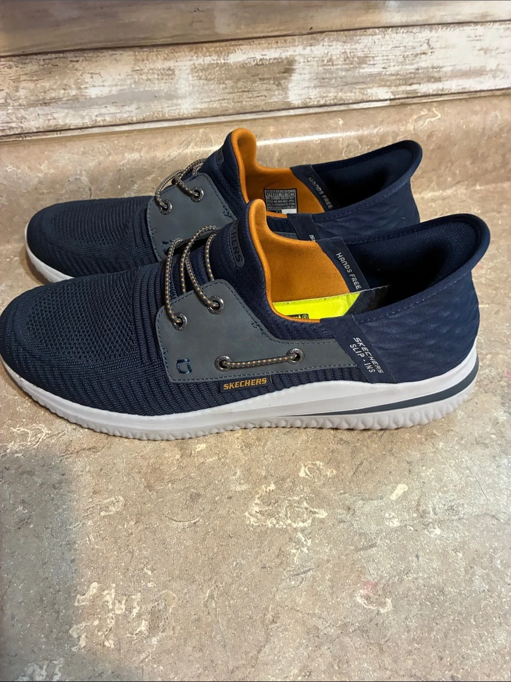 Skechers Men's Size 12 Navy Knit Slip-On Sneakers with Orange Liner